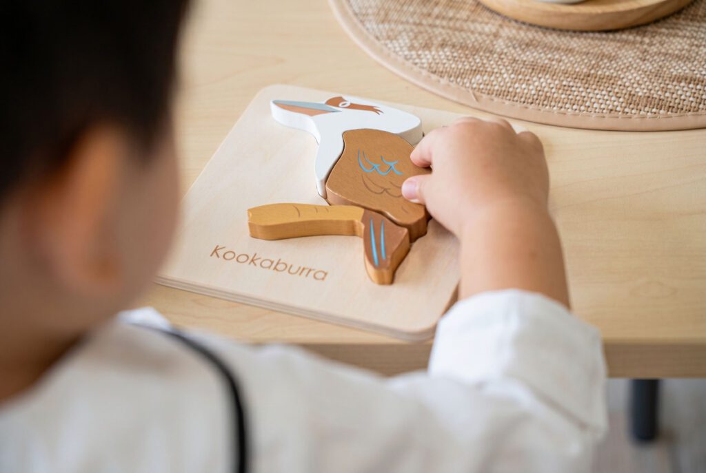 Tzu Chi classroom, child completing puzzle