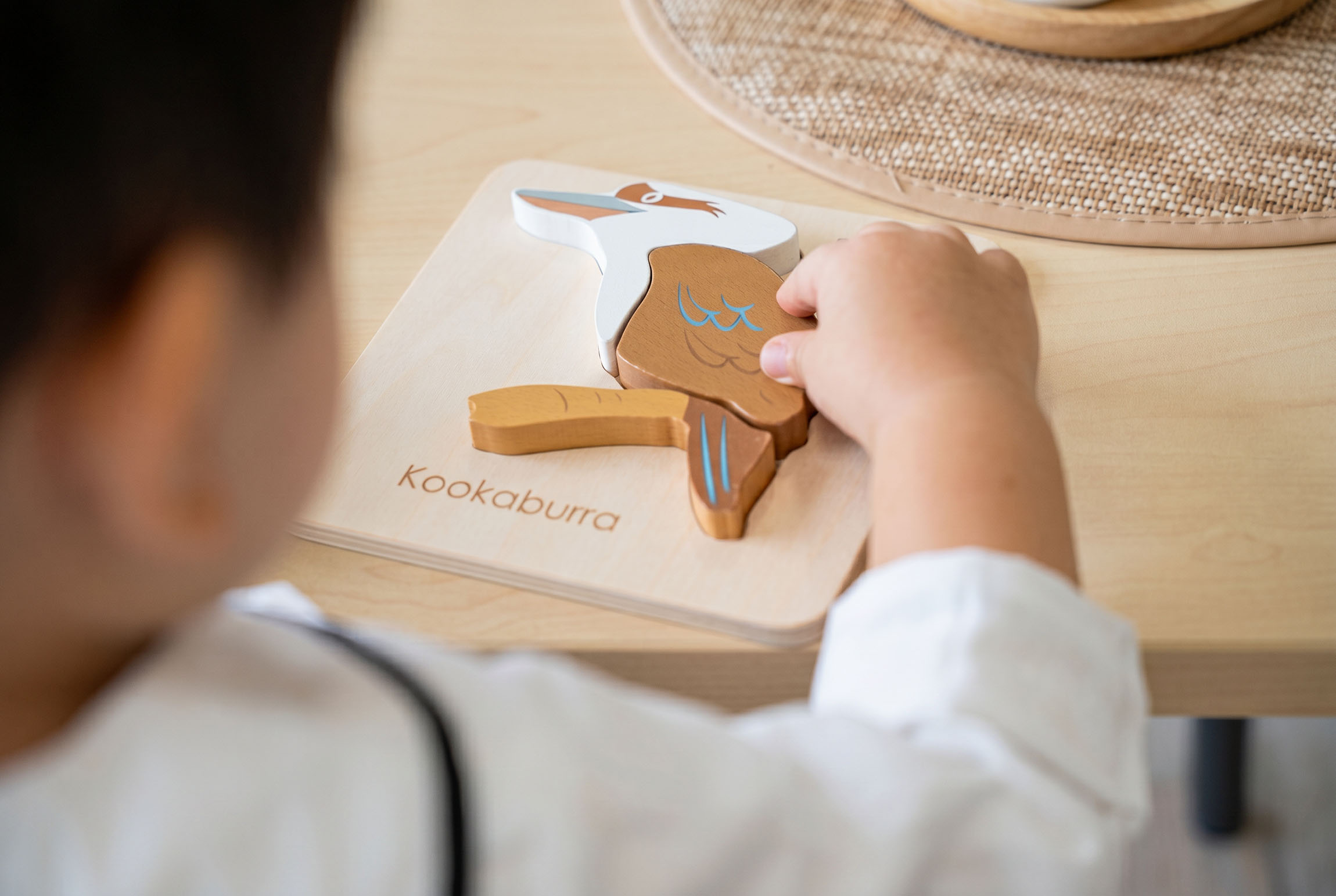 Tzu Chi classroom, child completing puzzle